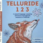 Book cover of "Telluride 123" featuring an illustrated fox, snowflakes, and text describing a mixed-language counting adventure through the seasons in Telluride.